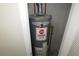A Performance Rheem water heater in a small room with white walls and gray baseboards at 2630 Colonial Dr, College Park, GA 30337
