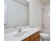 Clean bathroom features a wood vanity, large mirror, and a shower-tub combo at 3032 Cedar Glade Ln, Buford, GA 30519