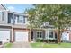 Charming townhome boasts a blend of brick and siding, complemented by a well-manicured lawn at 3032 Cedar Glade Ln, Buford, GA 30519