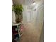 Bright hallway with neutral carpet, white doors and trim, and a whimsical display shelf filled with toys at 3032 Cedar Glade Ln, Buford, GA 30519