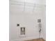Unfinished laundry room area featuring washer/dryer hookups and storage space at 3032 Cedar Glade Ln, Buford, GA 30519