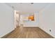 Open-concept living room with hardwood floors, neutral paint, and open view of the kitchen at 3032 Cedar Glade Ln, Buford, GA 30519