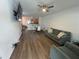 Comfortable living room with modern furniture, hardwood floors, and an open-concept layout at 3032 Cedar Glade Ln, Buford, GA 30519