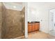 Bright bathroom features a glass shower and wooden cabinets at 3071 Lenox Ne Rd # 11, Atlanta, GA 30324