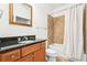 Bathroom with dark wood vanity, granite countertop, and a shower-tub combination at 3071 Lenox Ne Rd # 11, Atlanta, GA 30324