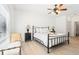 A spacious bedroom with wood floors, white walls, and a ceiling fan at 3071 Lenox Ne Rd # 11, Atlanta, GA 30324