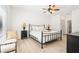A spacious bedroom with wood floors, white walls, and a ceiling fan at 3071 Lenox Ne Rd # 11, Atlanta, GA 30324