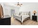 Bedroom features wood floors, white walls, ceiling fan and black furniture at 3071 Lenox Ne Rd # 11, Atlanta, GA 30324