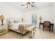Bright bedroom with a wooden-framed bed, accent lighting, and a comfortable sitting area at 3071 Lenox Ne Rd # 11, Atlanta, GA 30324