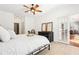 Spacious bedroom with ceiling fan, wood floors, and sliding glass doors to another room at 3071 Lenox Ne Rd # 11, Atlanta, GA 30324