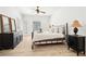 Spacious bedroom with white walls, wood floors, ceiling fan and black furniture at 3071 Lenox Ne Rd # 11, Atlanta, GA 30324