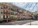 Brick building featuring balconies, and lush green landscaping at 3071 Lenox Ne Rd # 11, Atlanta, GA 30324