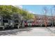 Multi-unit building with a mix of brick and light-colored exteriors, accented by mature trees at 3071 Lenox Ne Rd # 11, Atlanta, GA 30324