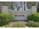 Stone entrance with 'The Vanderbilt' lettering, bordered by lush greenery at 3071 Lenox Ne Rd # 11, Atlanta, GA 30324