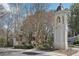 Community entrance with a classic tower, landscaping, and gated access at 3071 Lenox Ne Rd # 11, Atlanta, GA 30324