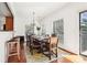 Sunlit dining room features hardwood floors, chandelier, and balcony access at 3071 Lenox Ne Rd # 11, Atlanta, GA 30324