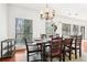 Charming dining room with natural light, set table, and scenic view at 3071 Lenox Ne Rd # 11, Atlanta, GA 30324