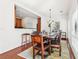 Cozy dining room with hardwood floors, chandelier, and breakfast bar access at 3071 Lenox Ne Rd # 11, Atlanta, GA 30324