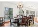 Bright dining room with hardwood floors, natural light, and view of wooded area at 3071 Lenox Ne Rd # 11, Atlanta, GA 30324
