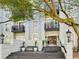 Elegant building facade with stately entrance, stone steps, and manicured landscaping at 3071 Lenox Ne Rd # 11, Atlanta, GA 30324