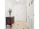 Bright foyer with tile flooring, a decorative chest, and a classic white door at 3071 Lenox Ne Rd # 11, Atlanta, GA 30324