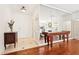 Bright foyer with decorative chest, tile flooring, mirrored wall, and wood floors beyond at 3071 Lenox Ne Rd # 11, Atlanta, GA 30324