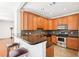 Kitchen featuring granite countertops, stainless steel appliances, and wood cabinetry at 3071 Lenox Ne Rd # 11, Atlanta, GA 30324