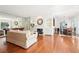Open living room with fireplace, hardwood floors, mirrored wall and access to dining area at 3071 Lenox Ne Rd # 11, Atlanta, GA 30324