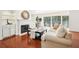 Bright living room boasts fireplace, hardwood floors, and sliding doors to a balcony at 3071 Lenox Ne Rd # 11, Atlanta, GA 30324