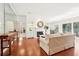 Light-filled living room with fireplace, hardwood floors, and access to a balcony at 3071 Lenox Ne Rd # 11, Atlanta, GA 30324
