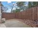 Small backyard with a privacy fence, providing a cozy outdoor area with scattered leaves at 2136 Garden Pl, Atlanta, GA 30316