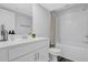 Bright bathroom featuring a white vanity, ample counter space, and a shower-tub combo at 2136 Garden Pl, Atlanta, GA 30316
