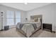 Cozy bedroom boasts natural light, neutral tones, and stylish furniture for a relaxing retreat at 2136 Garden Pl, Atlanta, GA 30316