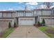Charming townhome exterior with a two-car garage, well-manicured lawn, and inviting curb appeal at 2136 Garden Pl, Atlanta, GA 30316