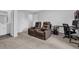 Spacious home theater area features comfortable seating and a convenient layout near bathroom and office at 2136 Garden Pl, Atlanta, GA 30316