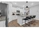 Bright, open kitchen with an island, stainless steel appliances, and white cabinets at 2136 Garden Pl, Atlanta, GA 30316