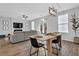 Bright, open-concept living room with a dining area, modern lighting and hardwood floors at 2136 Garden Pl, Atlanta, GA 30316