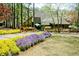 Community clubhouse featuring a well-manicured landscape with lush gardens and a grand entrance at 4941 Isle Royal Ct, Stone Mountain, GA 30088