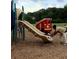 Fun playground area with slide and colorful train play structure for children to enjoy at 4941 Isle Royal Ct, Stone Mountain, GA 30088