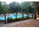 Resort style outdoor pool and gathering area with stage and outdoor seating at 4941 Isle Royal Ct, Stone Mountain, GA 30088