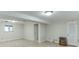 Spacious basement area with wood paneled walls, neutral floors and a small window at 130 Bonnie Ln, Sandy Springs, GA 30328