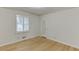 Bedroom featuring hardwood floors, neutral walls, and a window for natural light at 130 Bonnie Ln, Sandy Springs, GA 30328