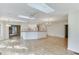 Modern kitchen with white cabinetry, skylight, breakfast bar, and updated appliances at 130 Bonnie Ln, Sandy Springs, GA 30328