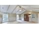 Living room with beamed ceiling, hardwood floors, and a door to the backyard at 130 Bonnie Ln, Sandy Springs, GA 30328