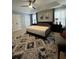 Bedroom showcasing a plush rug, contemporary decor, and ample natural light at 2162 Fall Creek Ldg, Loganville, GA 30052