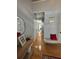 Bright and well-lit hallway with beautiful hardwood floors and decorative accents at 2162 Fall Creek Ldg, Loganville, GA 30052