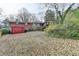 Exterior shot of the house including the backyard filled with leaves at 2516 Warwick Ne Cir, Atlanta, GA 30345