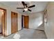 A standard bedroom with a ceiling fan, carpet, and doors at 2516 Warwick Ne Cir, Atlanta, GA 30345