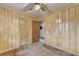 Bedroom with wood paneled walls, ceiling fan, carpeted floor and closet at 2516 Warwick Ne Cir, Atlanta, GA 30345