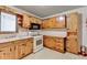 Functional kitchen with light wood cabinets and vintage appliances at 2516 Warwick Ne Cir, Atlanta, GA 30345